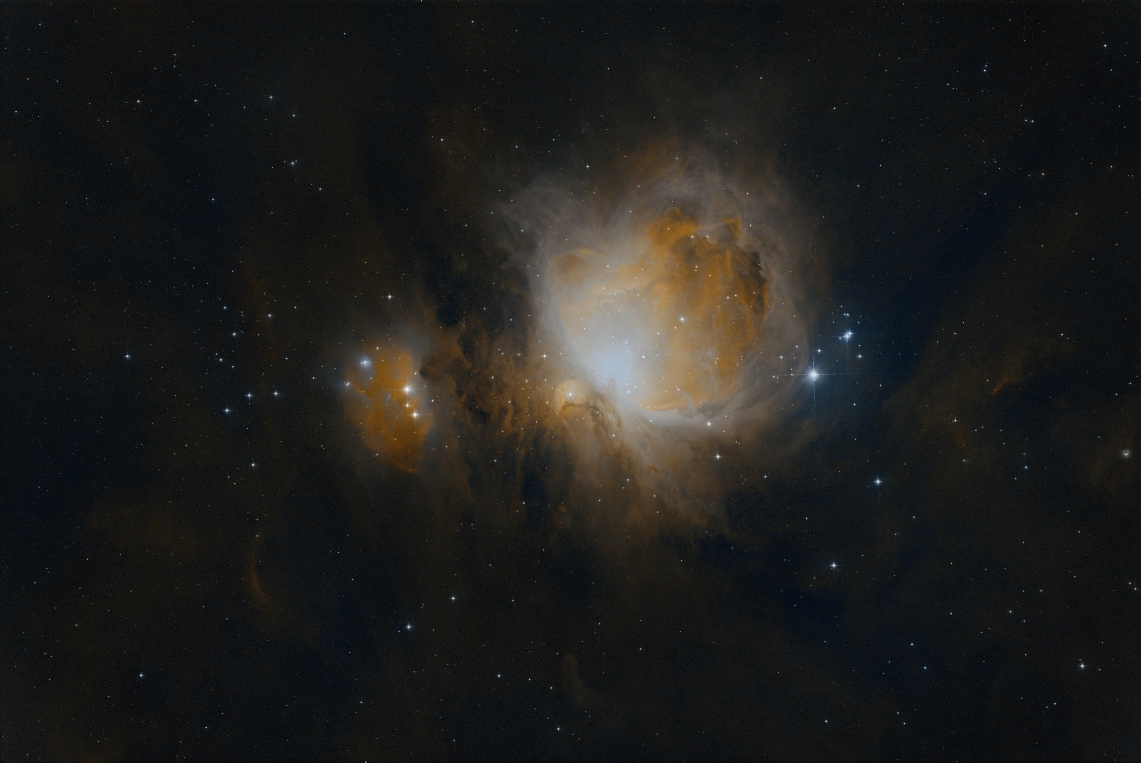Orion Nebula: A luminous centre wrapped in clouds and shadow.